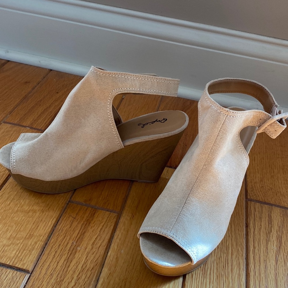 Tan suede like wedge sandals.